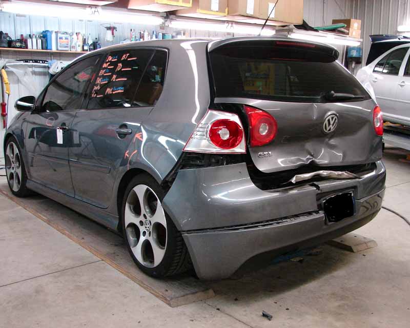 Volkswagen fender bent after rear collision.