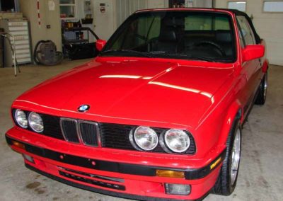 Red 1993 BMW 325i convertible E30 in mint condition after repairs.