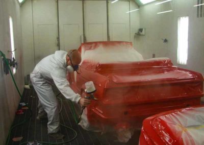 Red 1993 BMW 325i convertible E30 being painted red at Diamond Collision Services Inc.