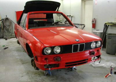 Red 1993 BMW 325i convertible E30 being repaired at Diamond Collision Services Inc.