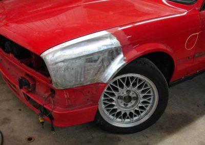 1993 BMW 325i convertible E30 front bumper being repaired at Diamond Collision Services Inc.