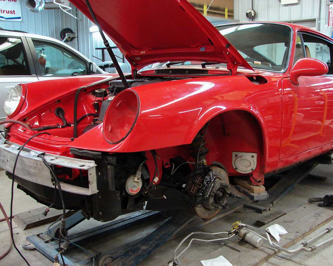 Red Porsche being repaired at Diamond Collision Services Inc. in Avon, IN.
